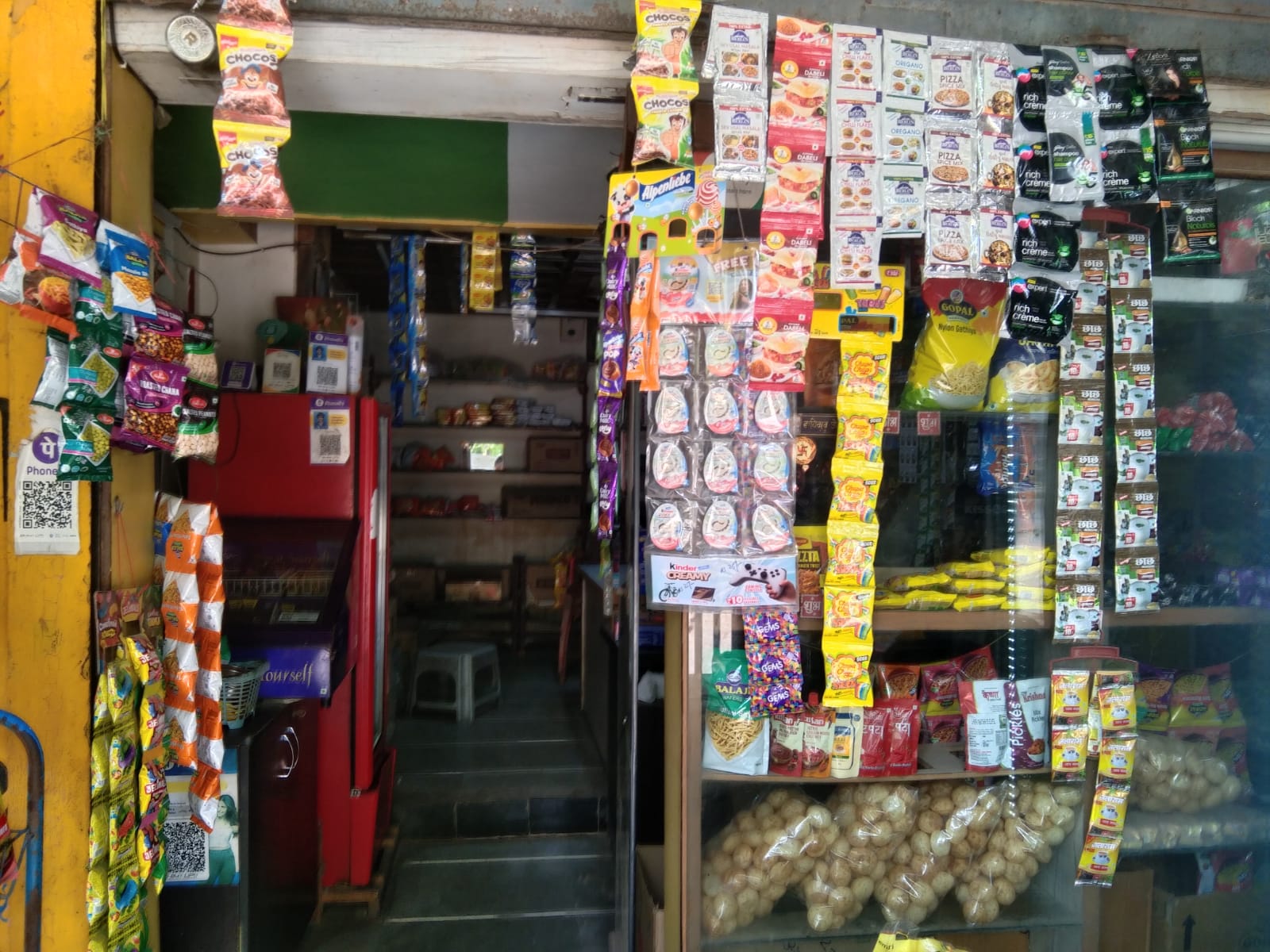 Inside Satnam Stores showing shelves and everyday products