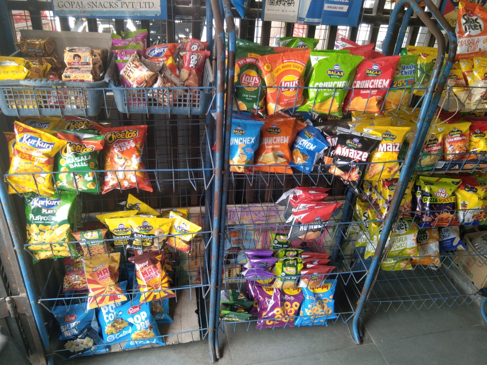 Snack display racks at Satnam Stores